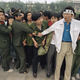 Students and police linked arms to keep crowds from Tiananmen Square.